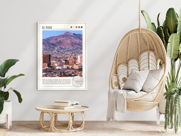 Descriptive Minimalist El Paso Poster in White Frame displayed in a modern living room with a wicker chair.