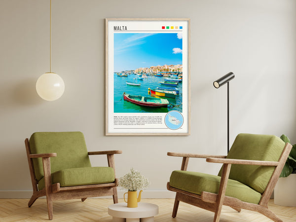 Descriptive Minimalist Malta Poster in Wooden Frame displayed in a living room with green chairs.