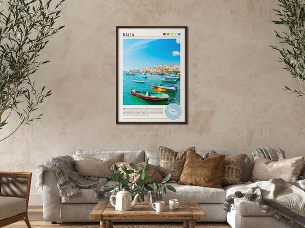 Descriptive Minimalist Malta Poster in Dark Wooden Frame displayed in a cozy living room with a beige sofa.