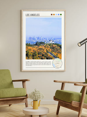 Descriptive Minimalist Los Angeles Poster in Wooden Frame displayed in a living room with green chairs.