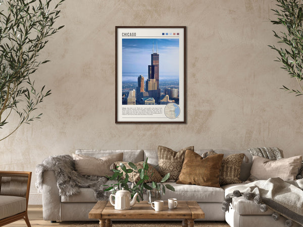 Descriptive Minimalist Willis Tower Poster in Dark Wooden Frame displayed in a cozy living room with a beige sofa.