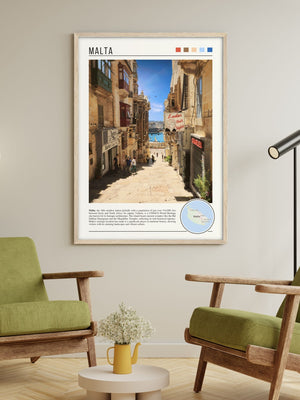 Descriptive Minimalist Malta Poster in Wooden Frame displayed in a living room with green chairs.