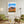 Descriptive Minimalist Big Bend Poster in Wooden Frame displayed in a living room with green chairs.