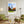 Descriptive Minimalist Washington Poster in Wooden Frame displayed in a living room with green chairs.