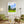 Descriptive Minimalist Washington Poster in Wooden Frame displayed in a living room with green chairs.