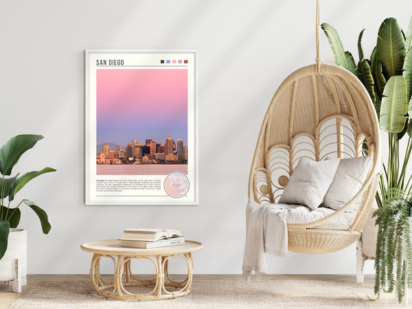 Descriptive Minimalist San Diego Poster in White Frame displayed in a modern living room with a wicker chair.