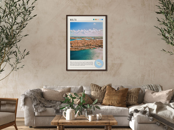 Descriptive Minimalist Malta Poster in Dark Wooden Frame displayed in a cozy living room with a beige sofa.