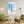 Descriptive Minimalist New York Poster in Wooden Frame displayed in a living room with green chairs.