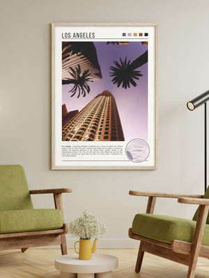 Descriptive Minimalist Los Angeles Poster in Wooden Frame displayed in a living room with green chairs.