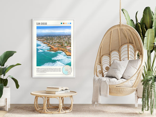 Descriptive Minimalist San Diego Poster in White Frame displayed in a modern living room with a wicker chair.