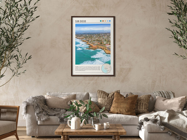 Descriptive Minimalist San Diego Poster in Dark Wooden Frame displayed in a cozy living room with a beige sofa.