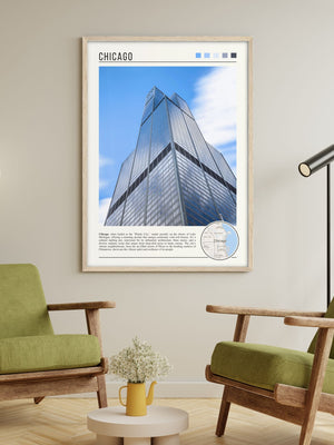 Descriptive Minimalist Willis Tower Poster in Wooden Frame displayed in a living room with green chairs.