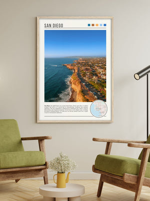 Descriptive Minimalist San Diego Poster in Wooden Frame displayed in a living room with green chairs.