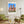 Descriptive Minimalist Washington Poster in Wooden Frame displayed in a living room with green chairs.