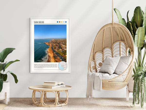 Descriptive Minimalist San Diego Poster in White Frame displayed in a modern living room with a wicker chair.