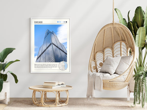 Descriptive Minimalist Willis Tower Poster in White Frame displayed in a modern living room with a wicker chair.