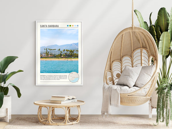 Descriptive Minimalist Santa Barbara Poster in White Frame displayed in a modern living room with a wicker chair.