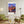 Descriptive Minimalist Boston Poster in Wooden Frame displayed in a living room with green chairs.